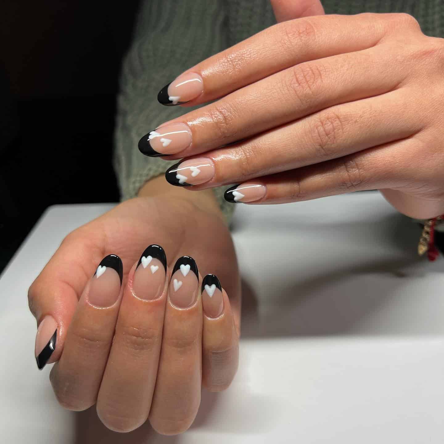 13. Dual-Tone French with White Hearts - black valentine nail ideas