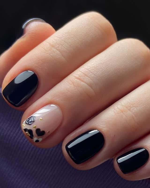 17. Chic Black with Heart Accent - black valentine nail ideas