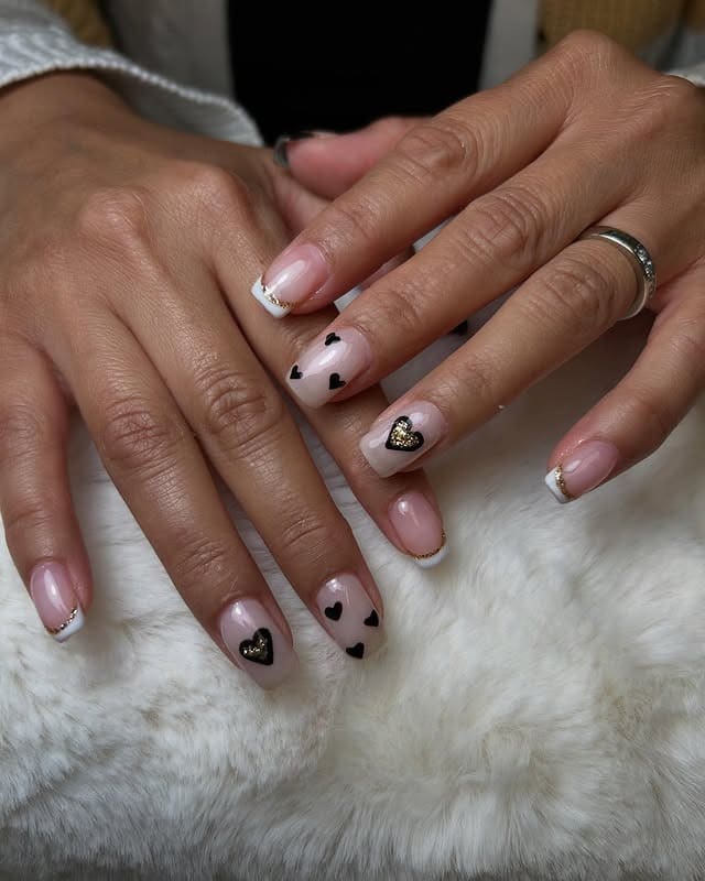 19. Gold-Trimmed Black Hearts - black valentine nail ideas