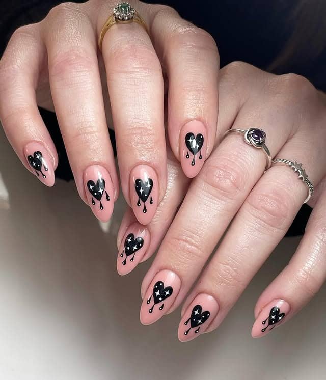 21. Dripping Black Heart Design - black valentine nail ideas