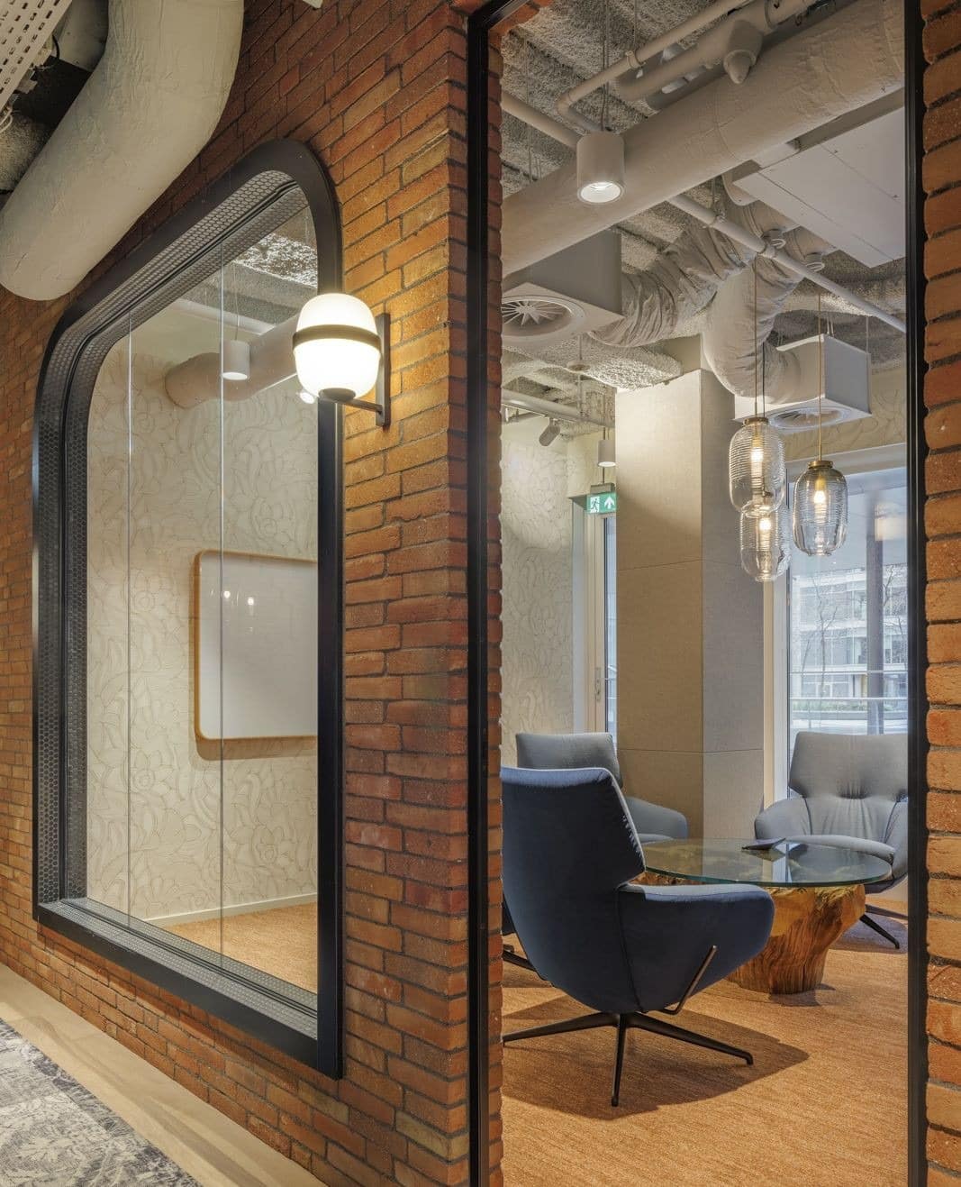 11. Industrial Warmth with Textured Brick - cool office ideas