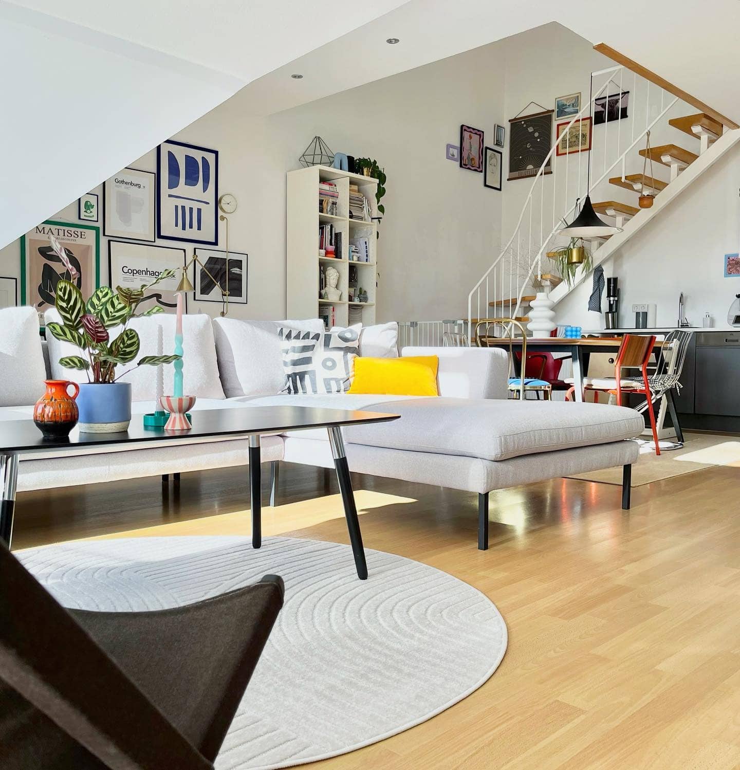 12. Playful Modern Living with Pops of Color - open living room ideas