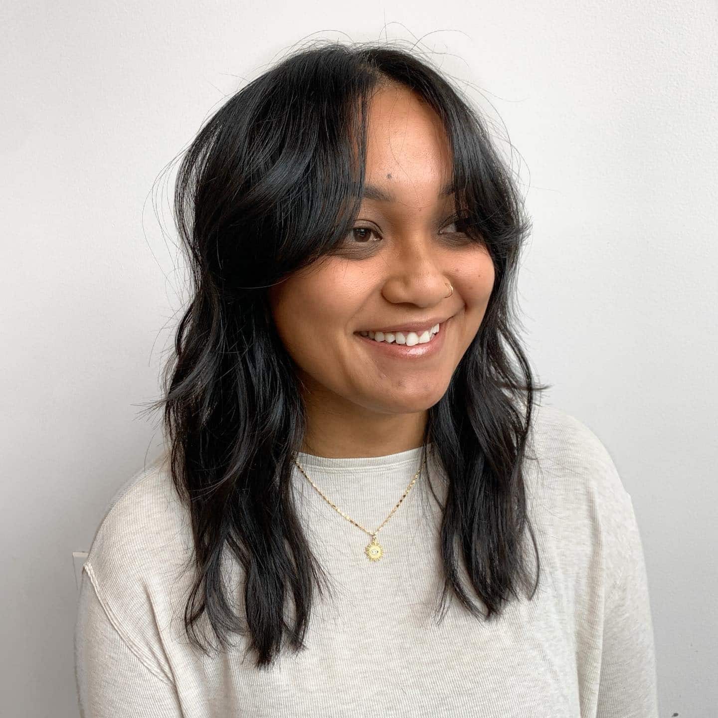 5. Tousled Layers with Subtle Curtain Bangs - Layered Hairstyles