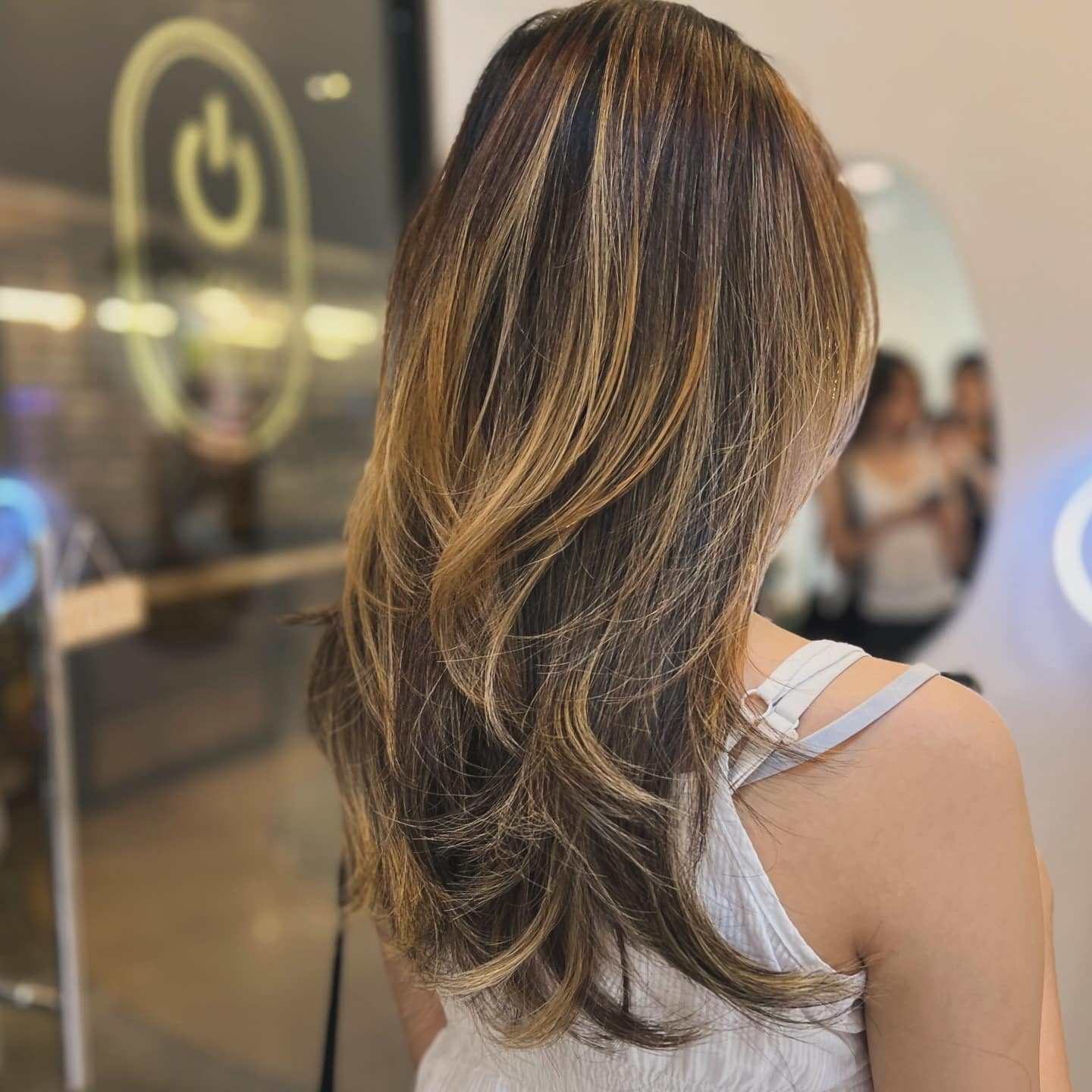 11. Golden Layered Balayage with Flowing Ends - Layered Hairstyles