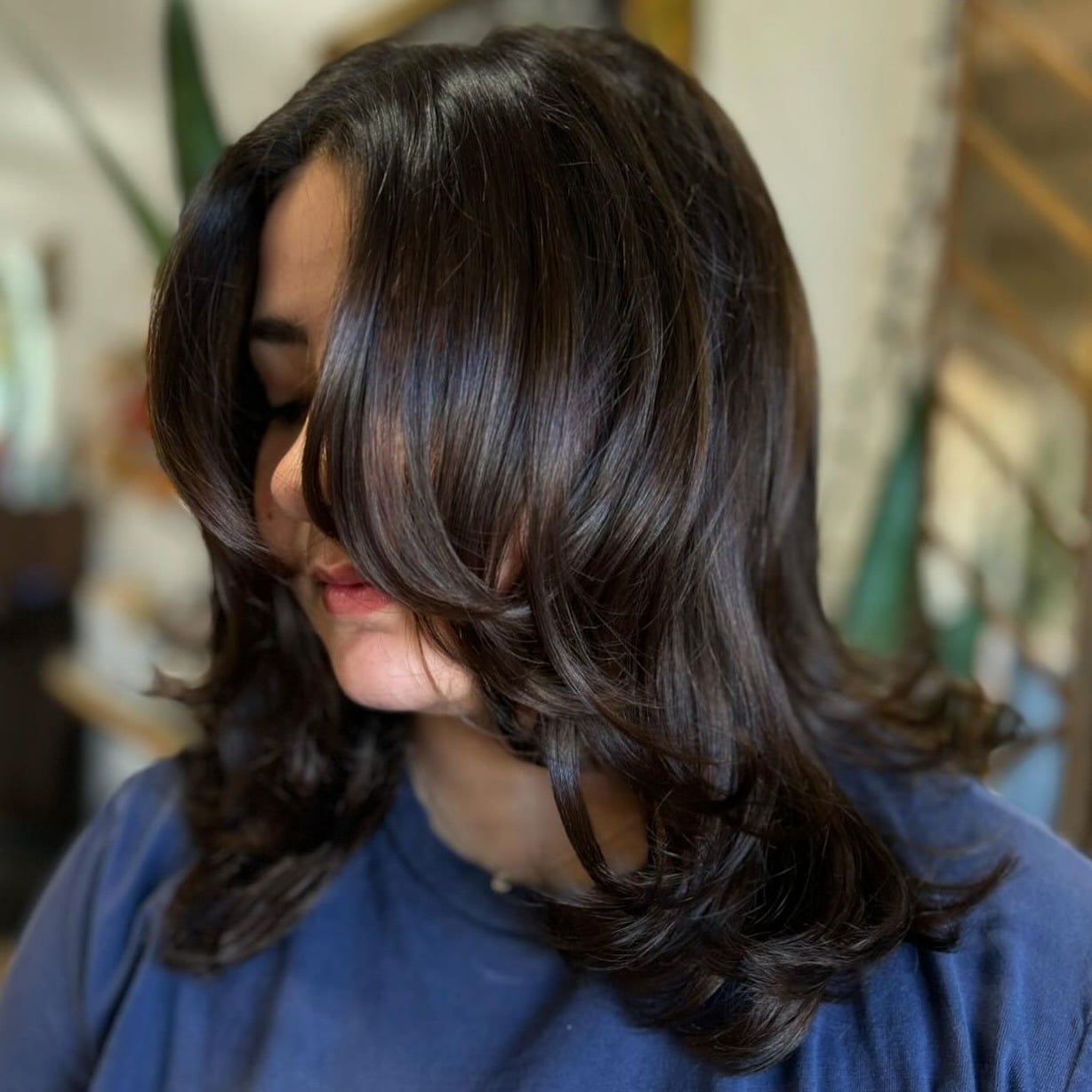 16. Voluminous Layers with Glossy Dark Finish - Layered Hairstyles