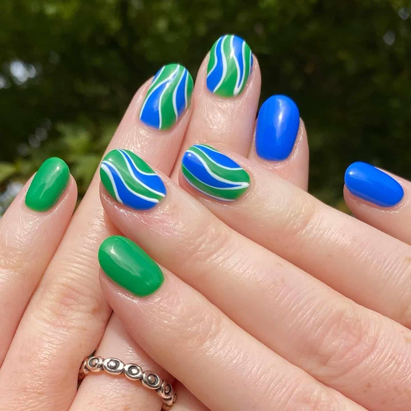 6. Ocean Wave Flow Nails - blue and green nail ideas