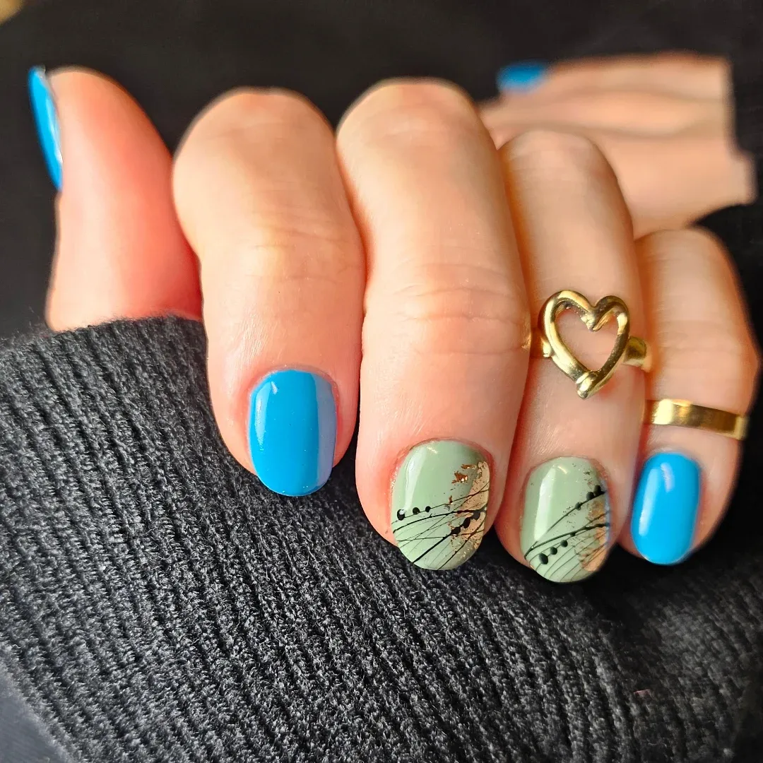 14. Abstract Nature Accent Nails - blue and green nail ideas