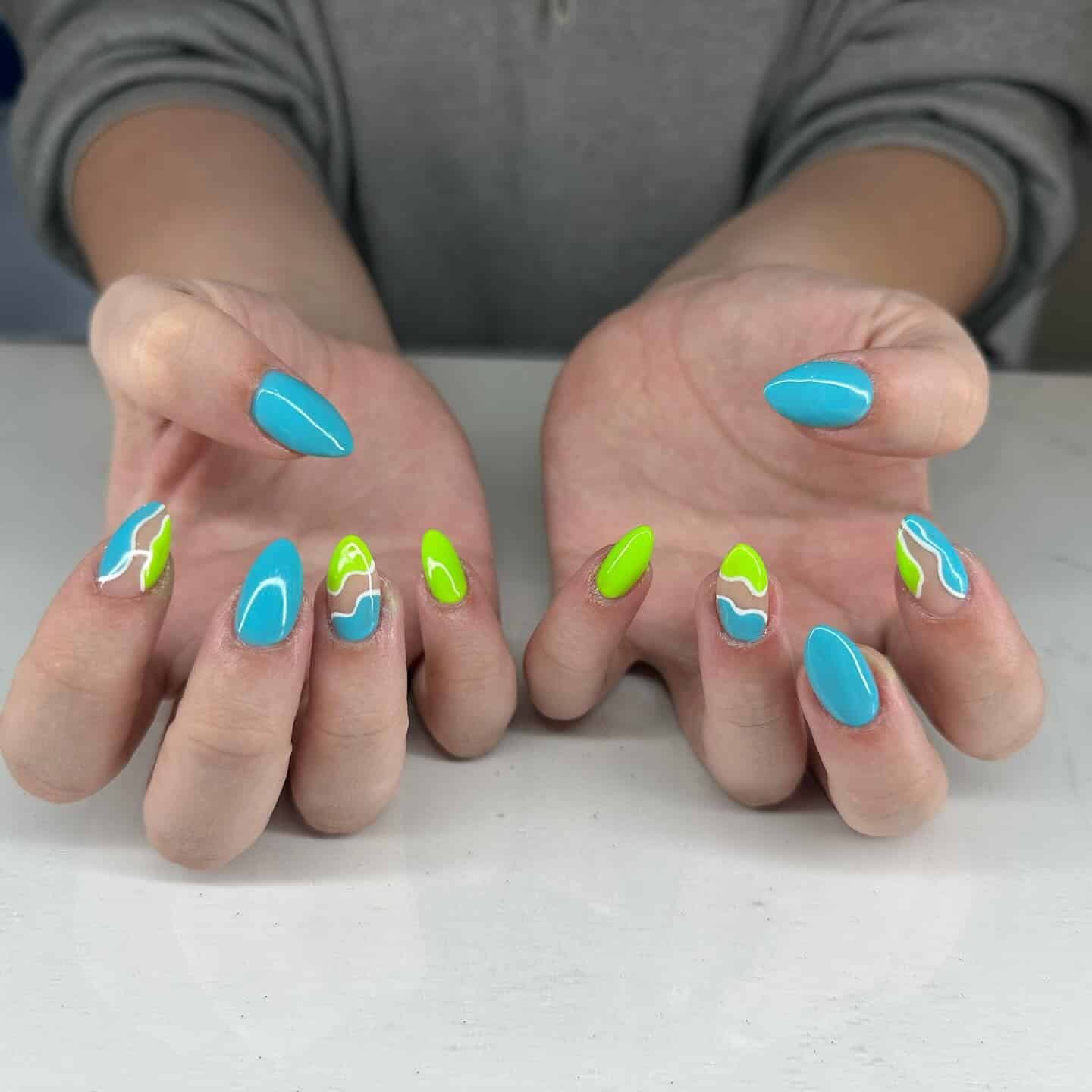 16. Wavy Neon Duo Nails - blue and green nail ideas