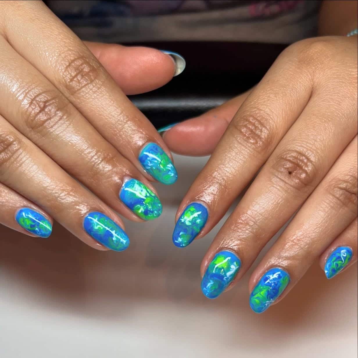 18. Marble Glow Blue Nails - blue and green nail ideas