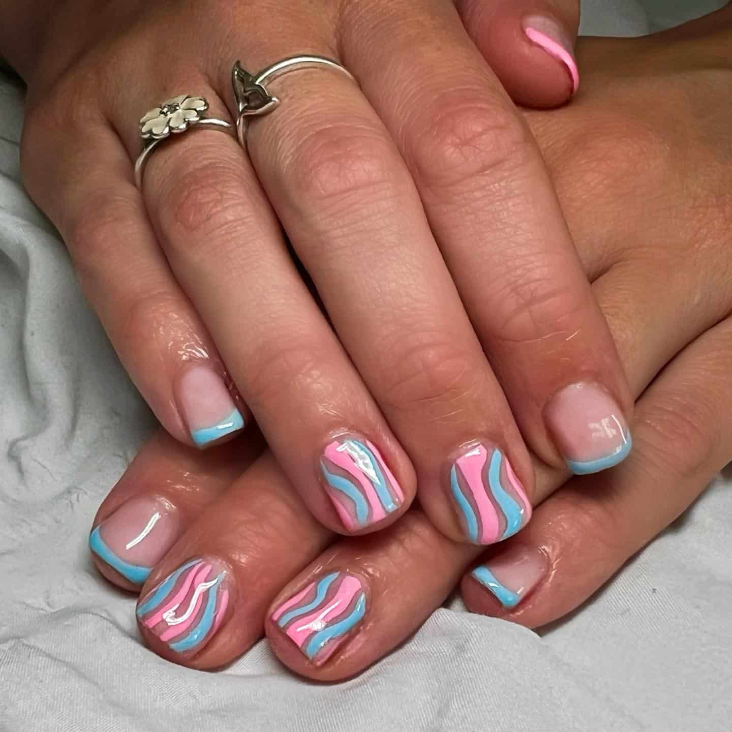 6. Wavy Pastel Stripes - blue and pink nail ideas