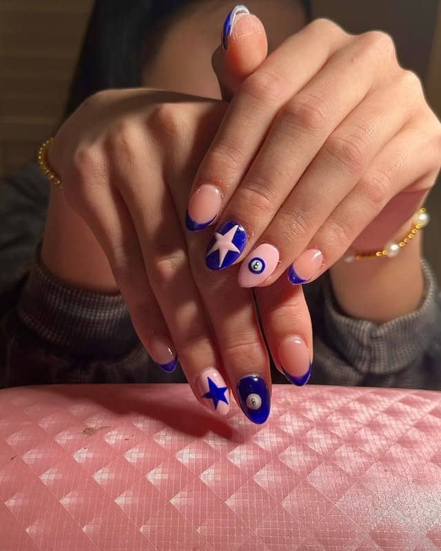 22. Midnight Blue French with Star Accents - blue and pink nail ideas