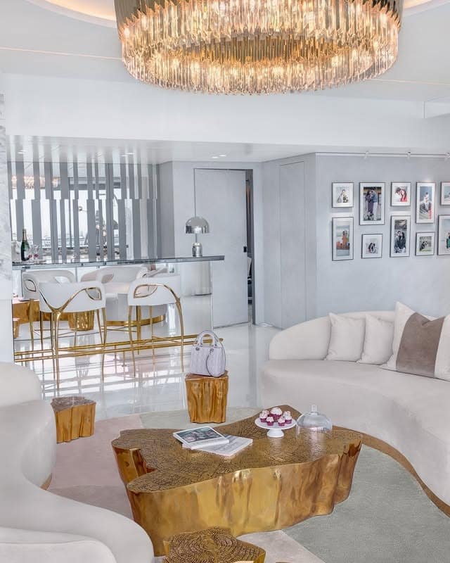 9. Glam Statement with Sculptural Gold Furnishings - white and gold living room ideas