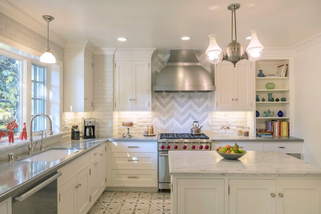 3. Classic White with Subtle Chevron Detail - earth tones kitchen ideas