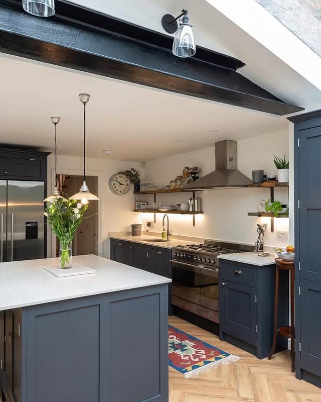 5. Charcoal Blue with Natural Light - earth tones kitchen ideas