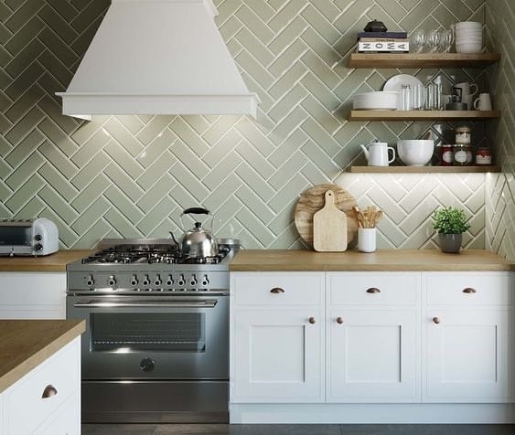 18. Sage Green Backsplash with White Cabinetry - earth tones kitchen ideas
