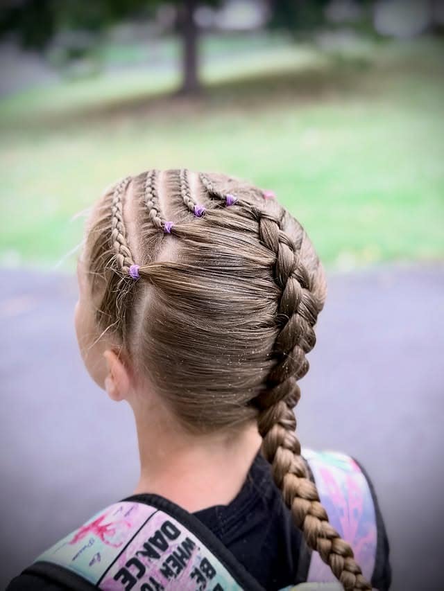 16. Playful Side Cornrows into French Braid on Light Brown Hair - Braided Hairstyles