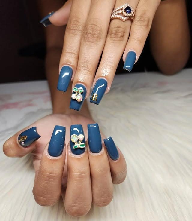 7. Teal Coffin Nails with 3D Embellishments - blue coffin nail ideas