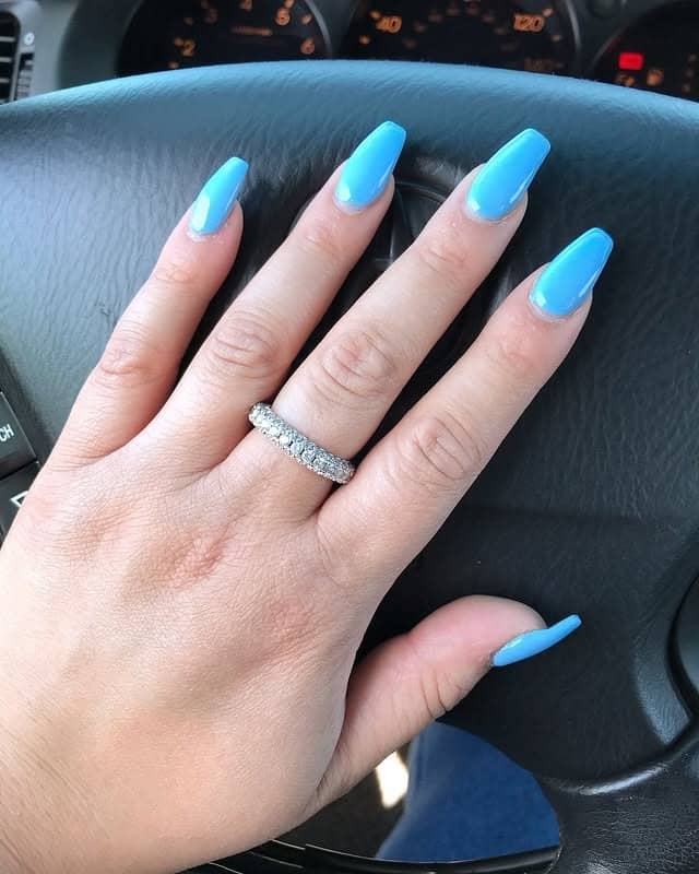 10. Soft Blue Glossy Coffin Nails - blue coffin nail ideas