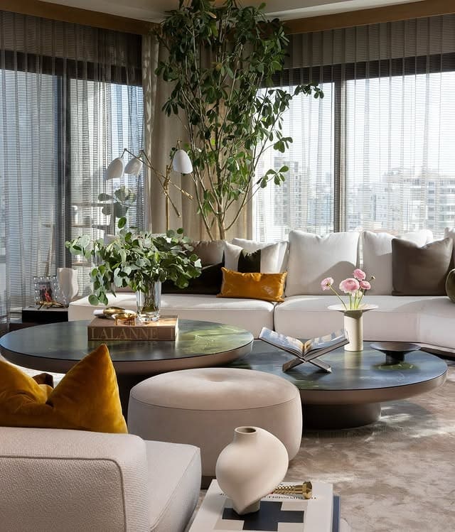 7. Contemporary Chic with Warm Accents - living room ideas with indoor plants