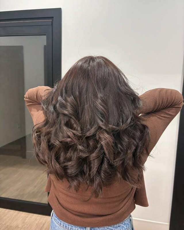 10. Voluminous Espresso Curls - Warm Brown Hair Color
