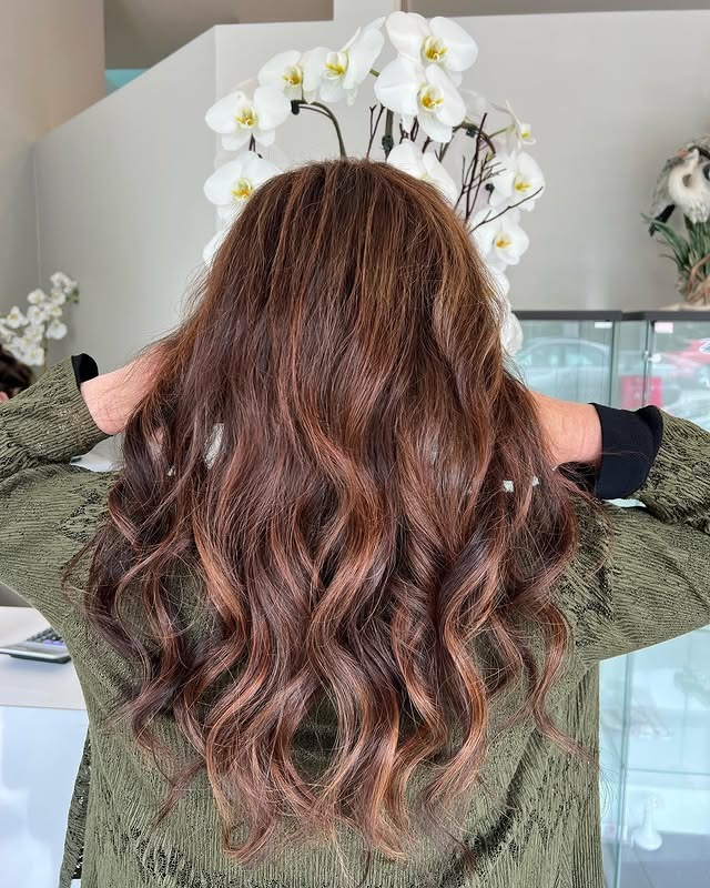 12. Chestnut Brown Curls - Warm Brown Hair Color