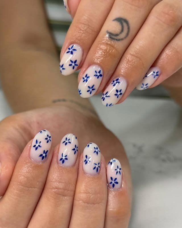 1. Minimal Blue Blossom Nails - blue floral nail ideas