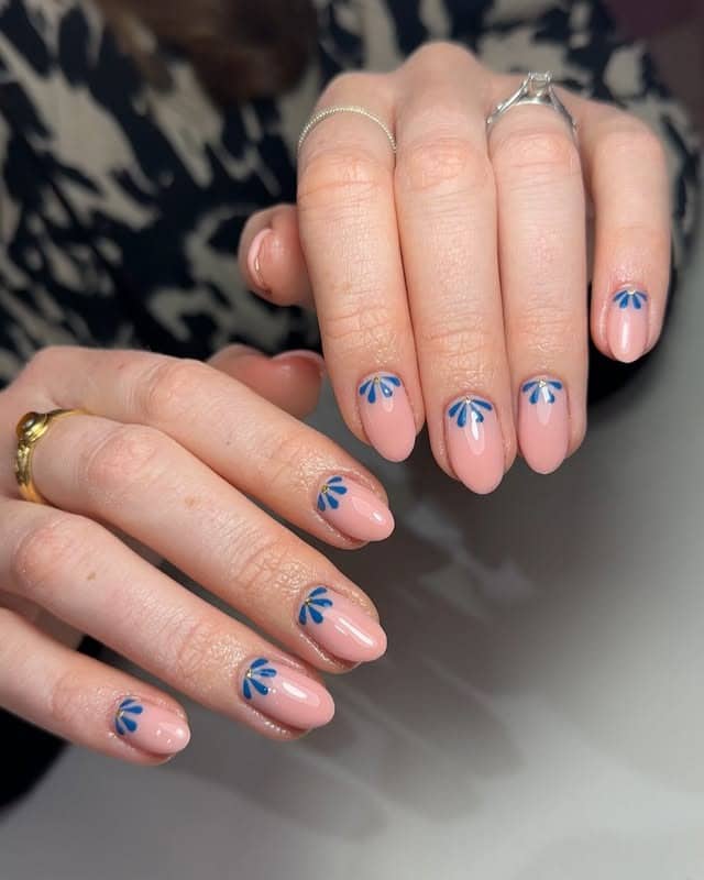 6. Half-Petal Elegance - blue floral nail ideas