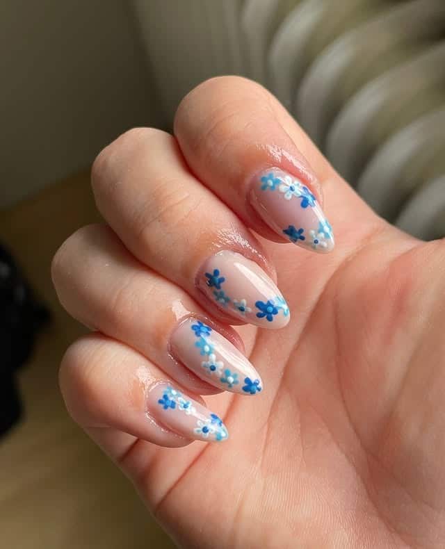 15. Scattered Petite Florals - blue floral nail ideas