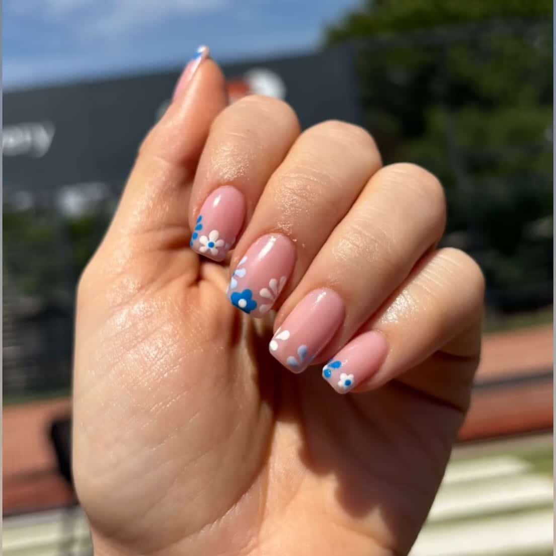 16. Playful Blue and White Blossoms - blue floral nail ideas