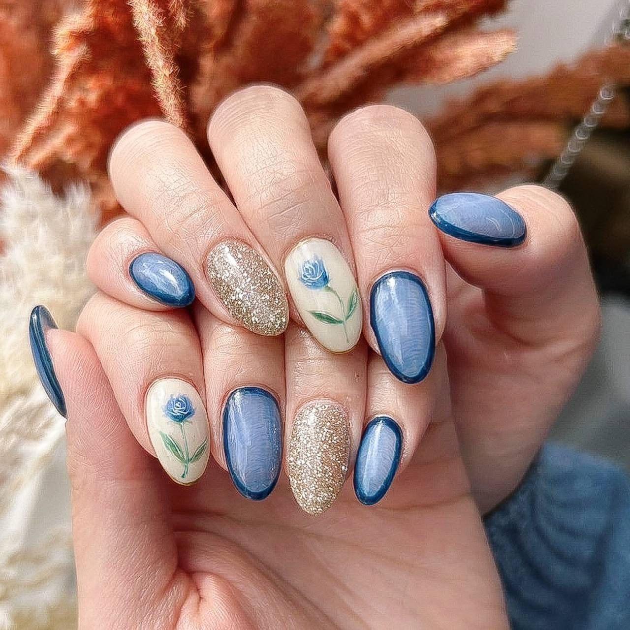 18. Blue Rose & Glitter Accents - blue floral nail ideas