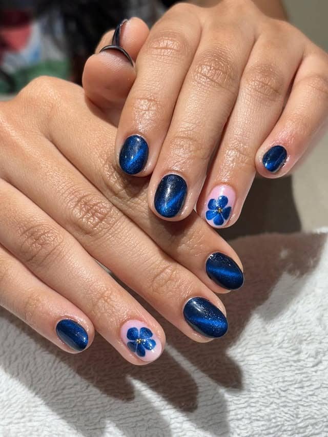 19. Midnight Blue with Bold Florals - blue floral nail ideas