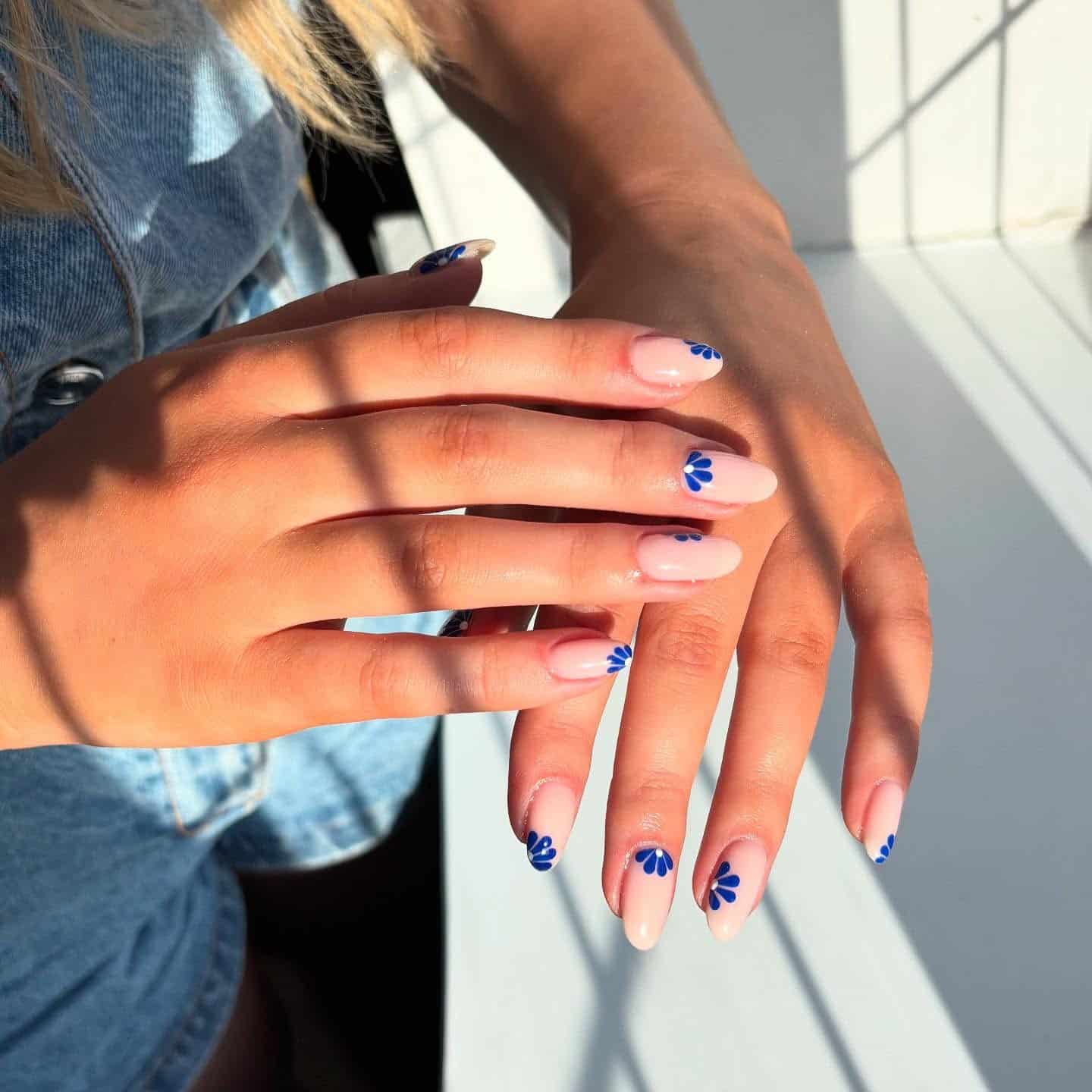 21. Navy Petal Accent Nails - blue floral nail ideas