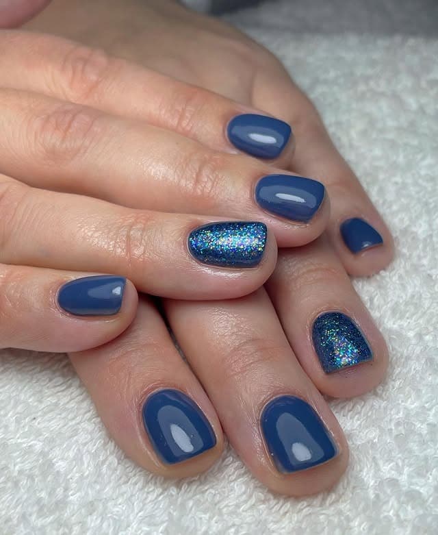 6. Navy Glam with Glitter Accent - blue glitter nail ideas