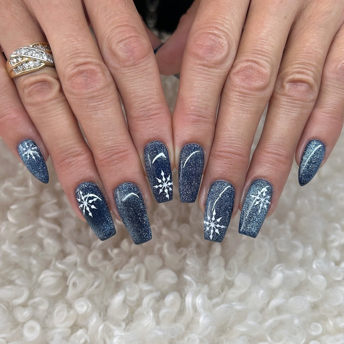 11. Snowflake Sparkle Coffin Nails - blue glitter nail ideas
