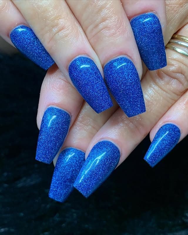 15. Sapphire Glitter Coffin Nails - blue glitter nail ideas