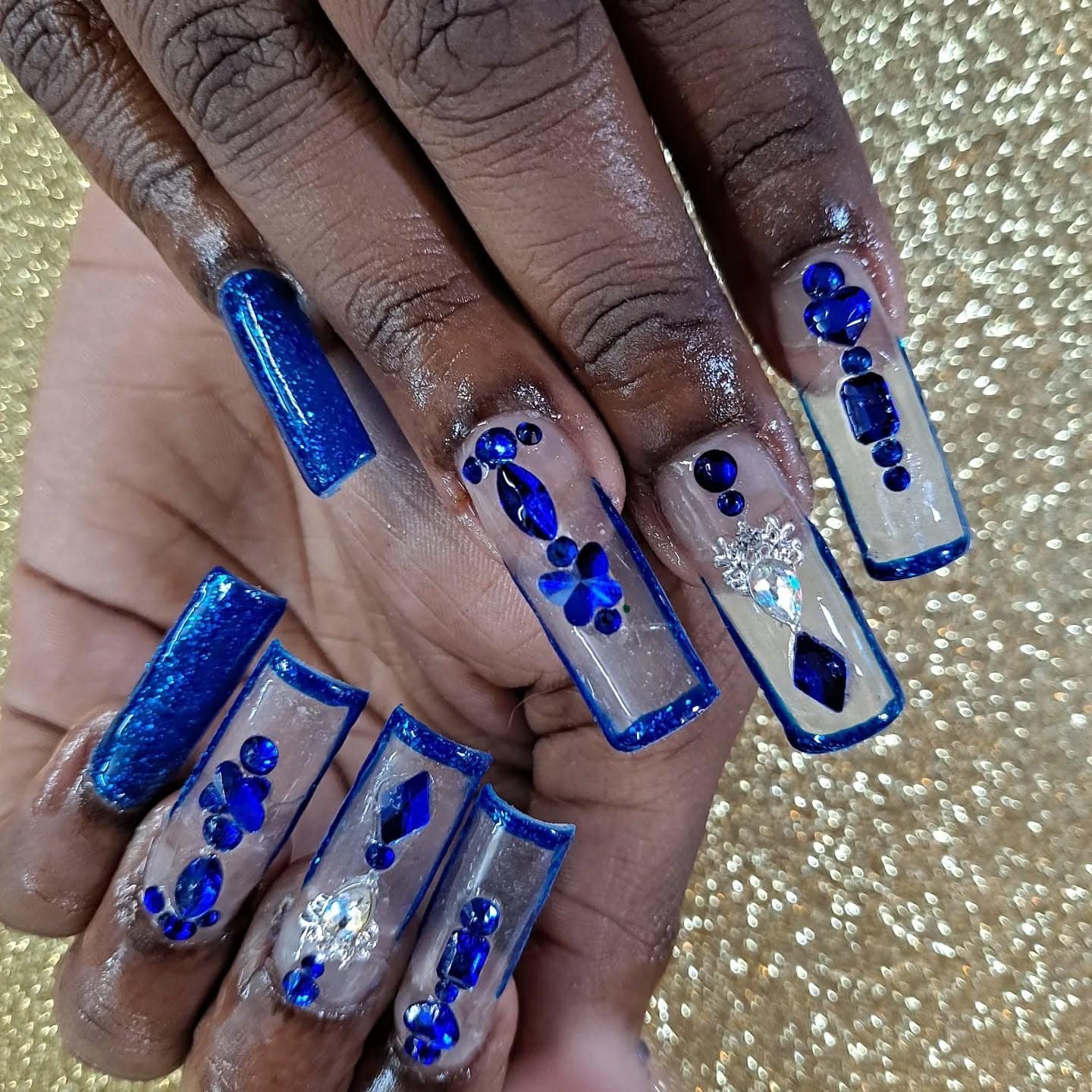 16. Crystal Clear Sapphire Embellished Nails - blue glitter nail ideas