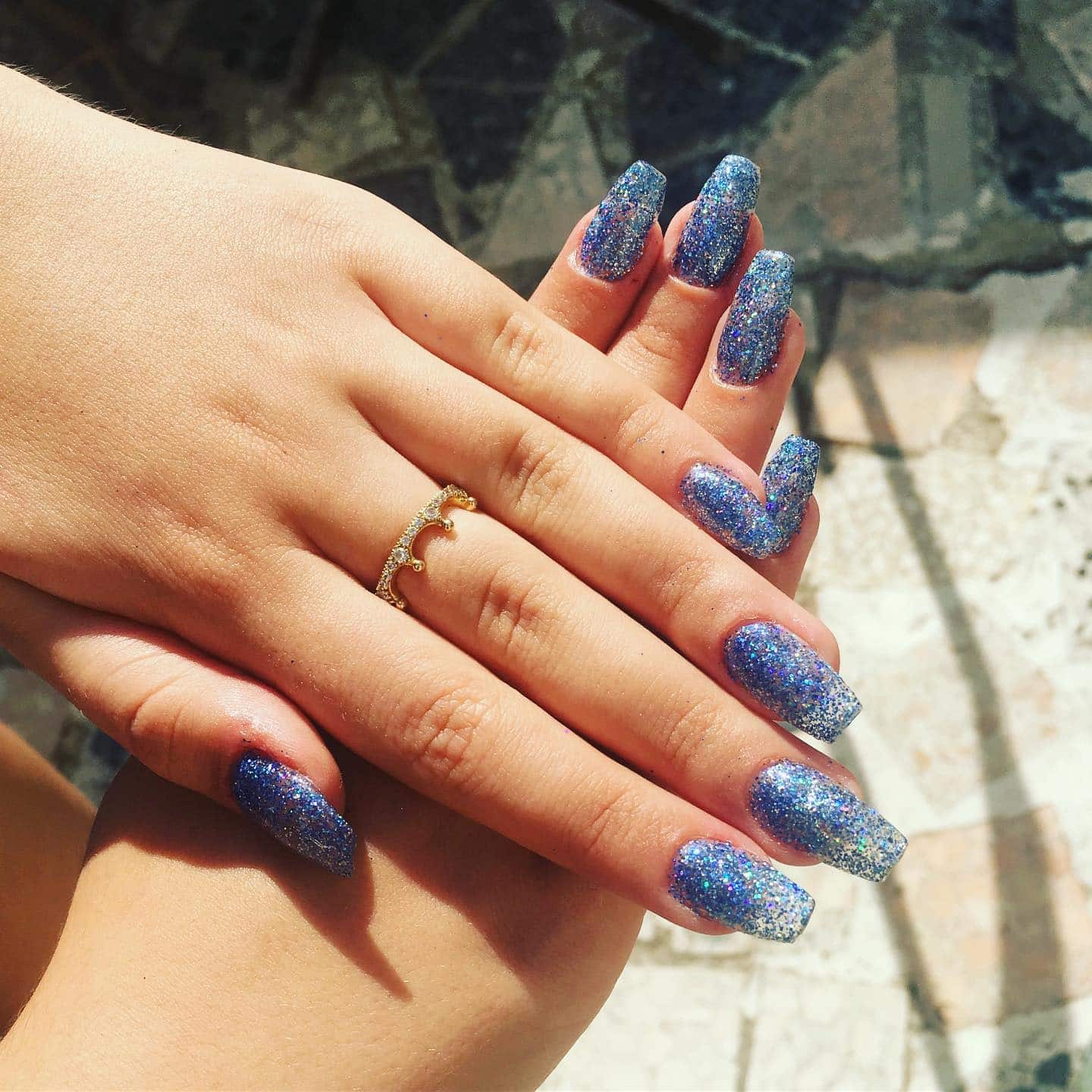 20. Silver-Blue Glitter Bomb Coffin Nails - blue glitter nail ideas