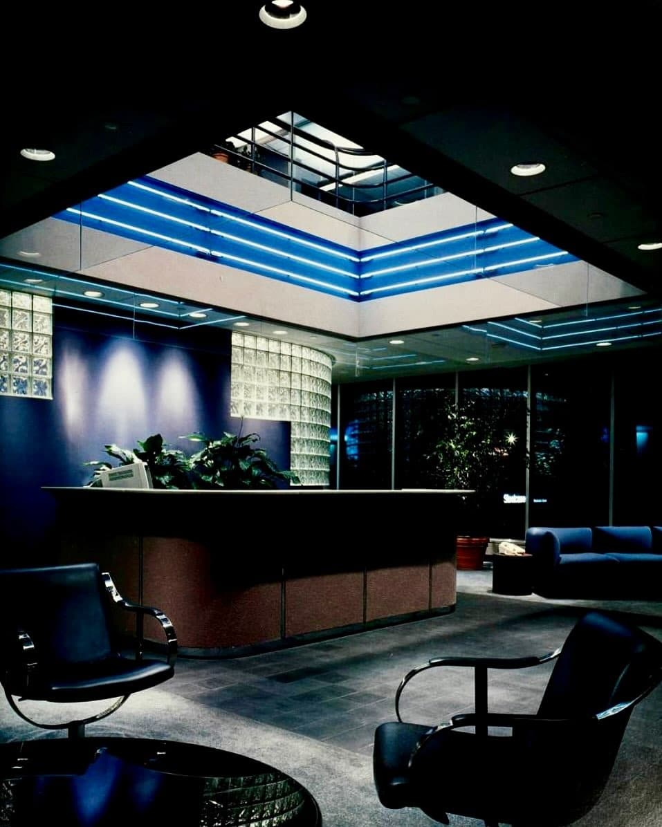4. Futuristic 1980s Reception with Neon Accents - vintage office ideas