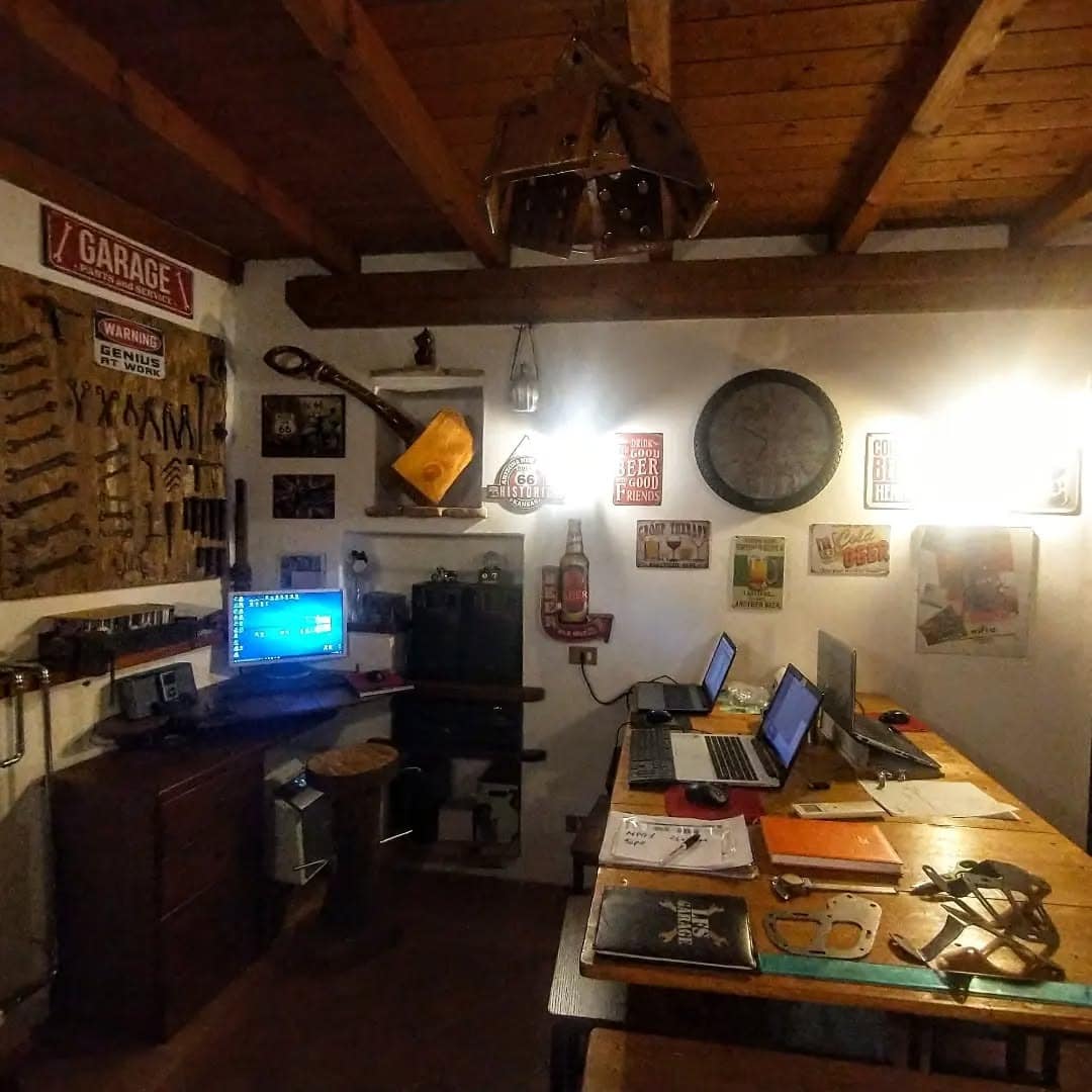 10. Garage-Style Workshop Office with Rustic Warmth - vintage office ideas