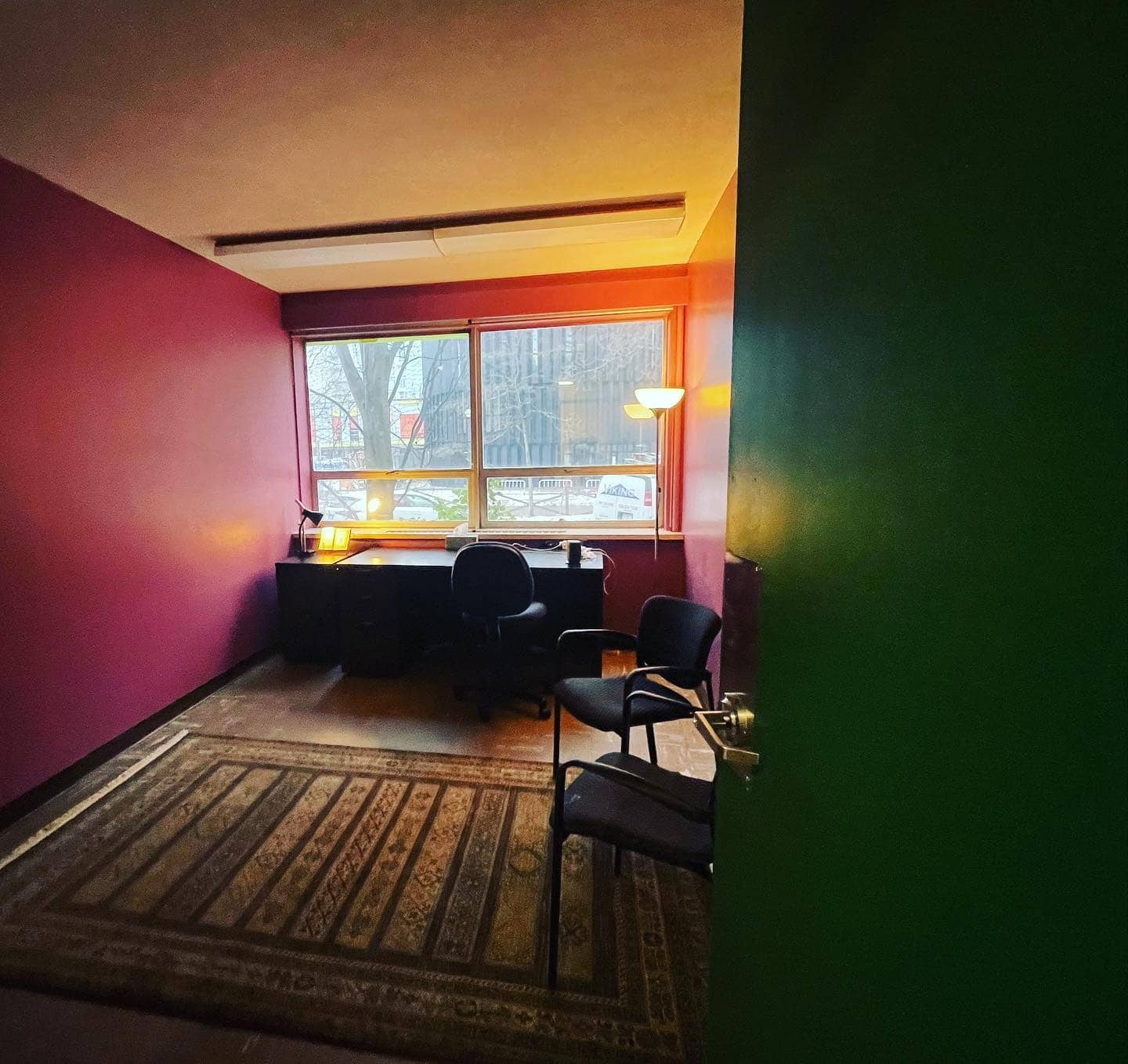 2. Warm Mulberry Workspace with Urban View - purple office ideas