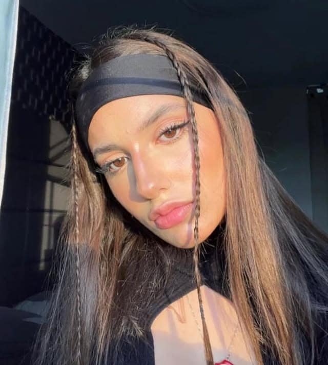 10. Sleek Brunette with Black Wrap - Headband Hairstyles