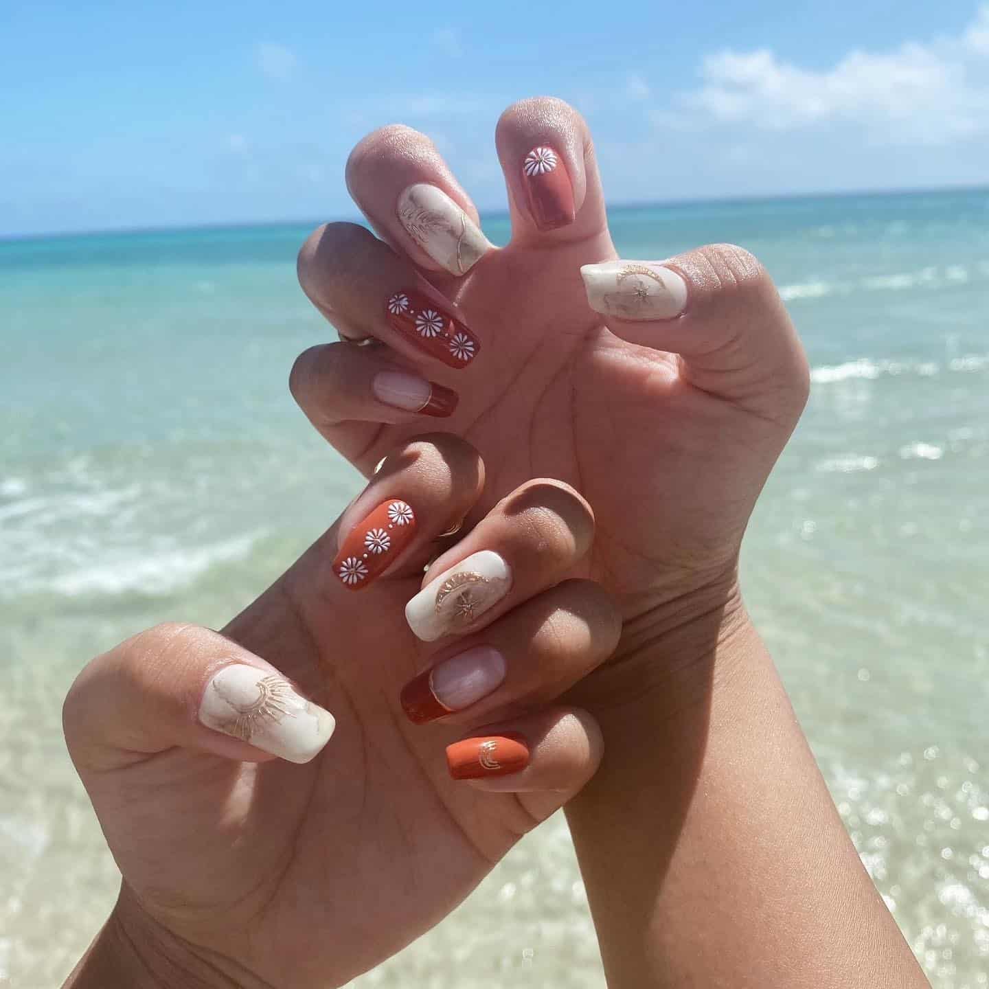 11. Daisy Dreams with Terracotta Accents - boho nail ideas