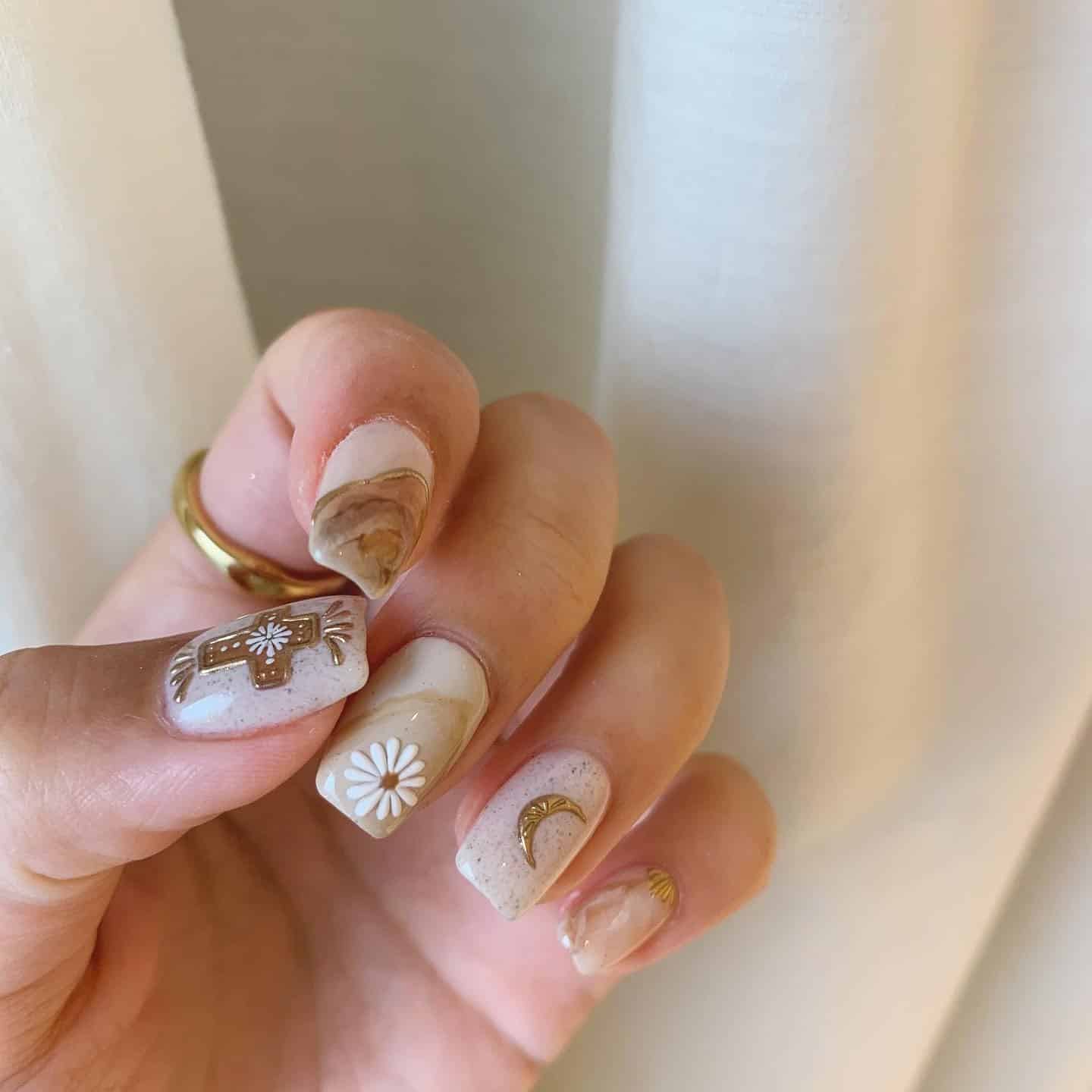 19. Golden Desert Marbles - boho nail ideas