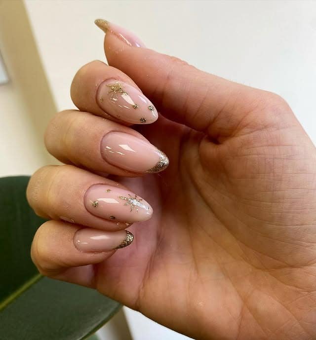 20. Starlit Nude with Glittering Tips - boho nail ideas