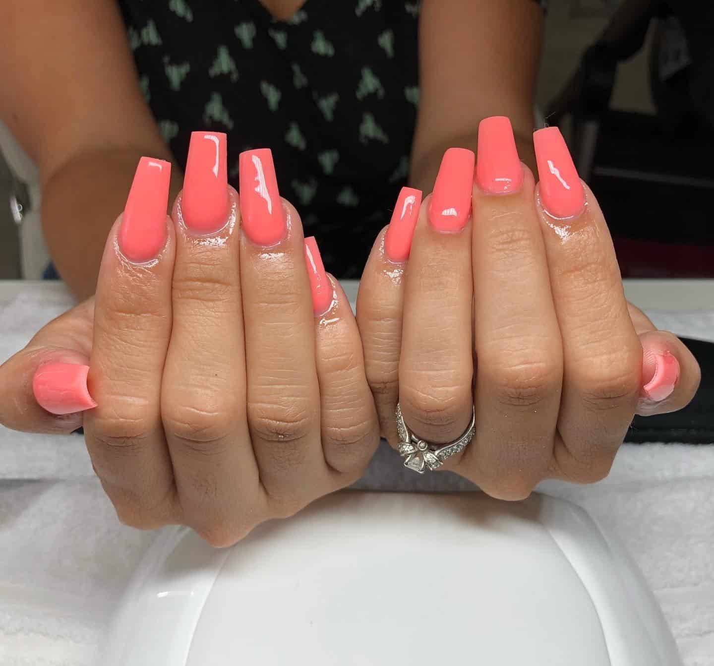 4. Coral Glow Elegance - bright color nail ideas