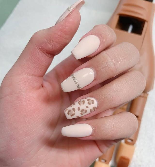 18. Nude Beige with Leopard Accent - bright color nail ideas