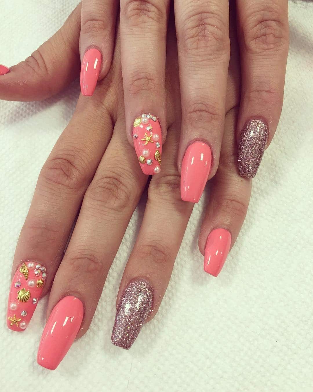 20. Coral Shine with Glitter Accent - bright color nail ideas