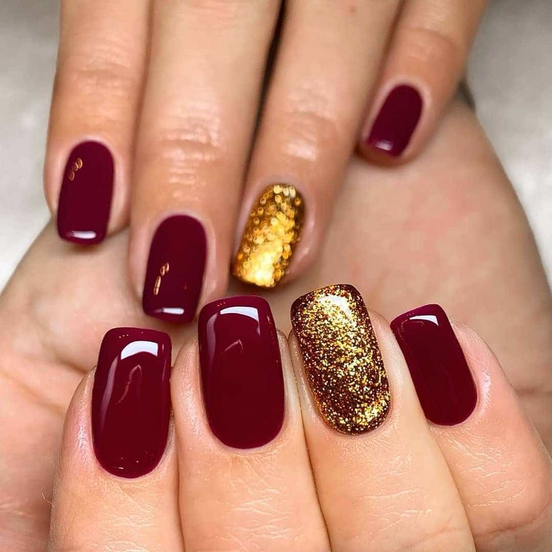 1. Classic Burgundy with Golden Sparkle Accent - burgundy and gold nail ideas