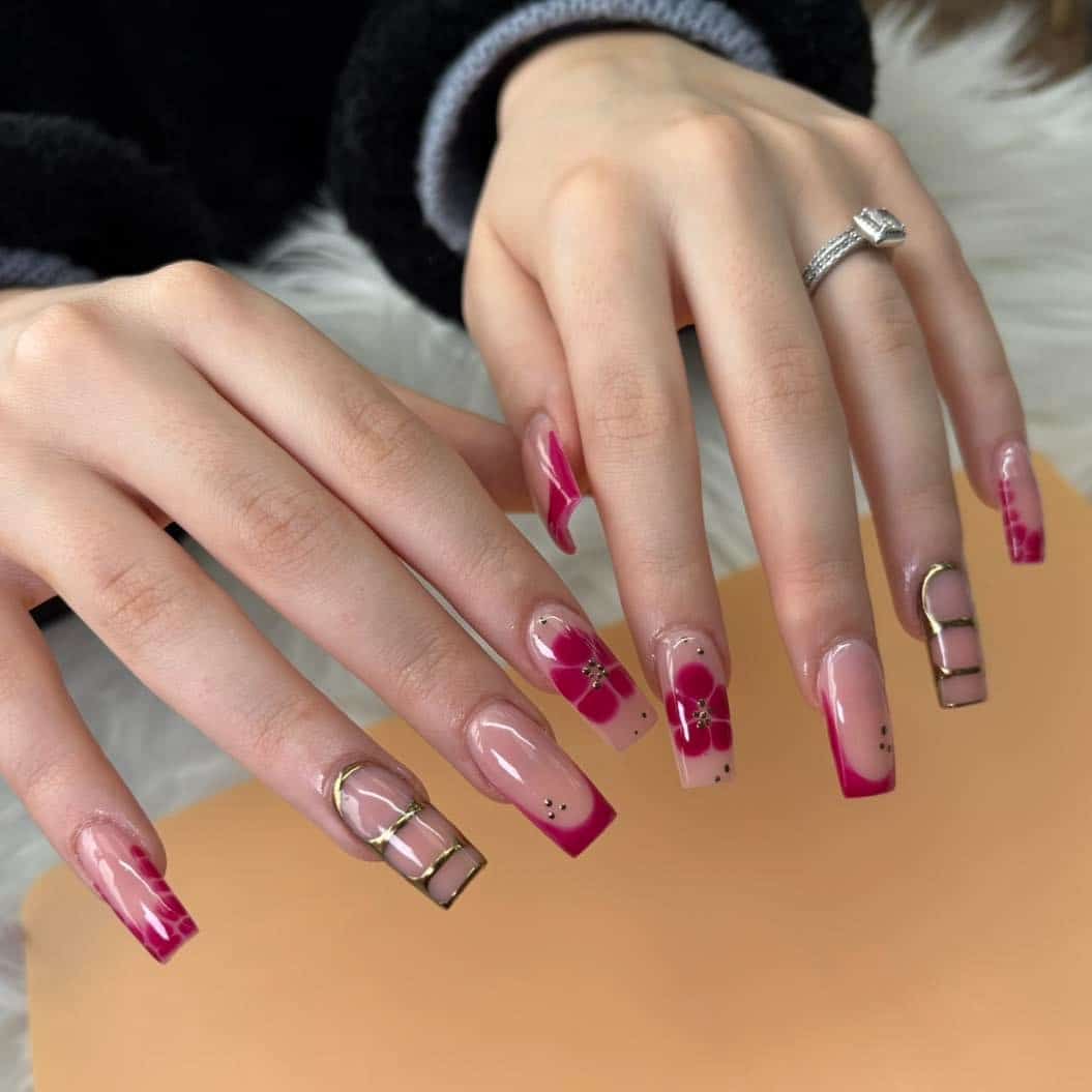 3. Burgundy French Tips with Floral and Geometric Accents - burgundy and gold nail ideas
