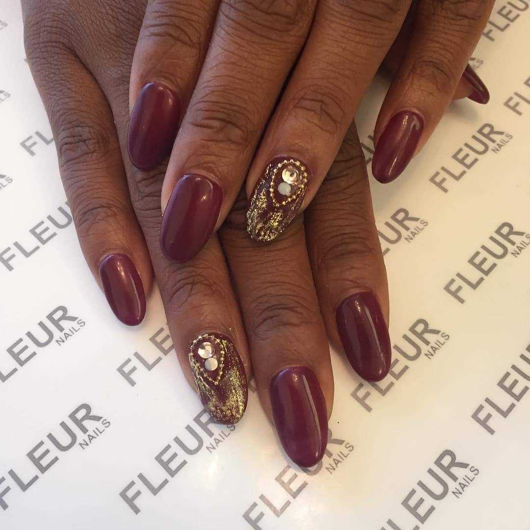 7. Burgundy with Gold Embellished Accent Nail - burgundy and gold nail ideas